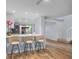 Contemporary kitchen area with barstool seating, open layout, and view to the patio making it great for entertaining at 25 Woods Landing Trl, Oldsmar, FL 34677