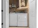 Laundry room featuring a washer and dryer hookup, with storage shelves above at 25 Woods Landing Trl, Oldsmar, FL 34677