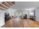 Spacious living room with hardwood floors, a staircase, and ample natural light at 25 Woods Landing Trl, Oldsmar, FL 34677