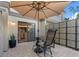 Cozy patio with an umbrella offering shade for outdoor seating at 25 Woods Landing Trl, Oldsmar, FL 34677