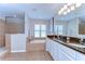Elegant bathroom with a double vanity, soaking tub, and a separate glass-enclosed shower at 2515 Cross More St, Valrico, FL 33594