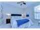 Cozy bedroom with plush carpeting, a comfortable bed, and a large window at 2515 Cross More St, Valrico, FL 33594