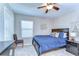 Comfortable bedroom with a ceiling fan, a chair, and stylish decor at 2515 Cross More St, Valrico, FL 33594
