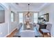 Elegant dining room with tray ceiling, modern chandelier, and views of the backyard at 2515 Cross More St, Valrico, FL 33594