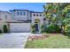 Charming two-story home with a two-car garage, manicured lawn and beautiful landscaping at 2515 Cross More St, Valrico, FL 33594