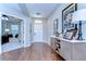 Inviting foyer with hardwood floors, stylish console table and view to the living room at 2515 Cross More St, Valrico, FL 33594