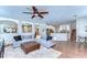 Spacious living room view showing wood floors, kitchen and dining areas at 2515 Cross More St, Valrico, FL 33594