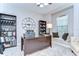 A bright home office with built-in shelving, a large desk, and a cozy window seat at 2515 Cross More St, Valrico, FL 33594