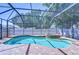 Screened-in pool and spa area with brick pavers and lush landscaping offering a private retreat at 2515 Cross More St, Valrico, FL 33594