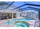 A refreshing pool with spa and screened enclosure, surrounded by a brick patio at 2515 Cross More St, Valrico, FL 33594