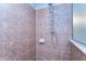 Tiled shower with multiple shower heads and a built-in soap dish at 2515 Cross More St, Valrico, FL 33594