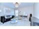 Chic sitting room with modern decor, a crystal chandelier, and ample natural light at 2515 Cross More St, Valrico, FL 33594