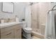 Modern bathroom with a sink, a toilet, and a walk-in shower with marble tiling at 2751 36Th N Ave, St Petersburg, FL 33713