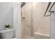 Contemporary bathroom featuring elegant white tiles, rainfall shower head, and a built-in shower seat at 2751 36Th N Ave, St Petersburg, FL 33713