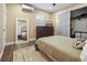 Cozy bedroom featuring a large mirror, a ceiling fan, and a closet with sliding doors at 2751 36Th N Ave, St Petersburg, FL 33713