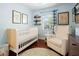 Charming Bedroom with hardwood floors, cozy seating and soft blue walls at 2751 36Th N Ave, St Petersburg, FL 33713