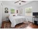 Relaxing bedroom with natural light, hardwood floors, ceiling fan, and closet space at 2751 36Th N Ave, St Petersburg, FL 33713