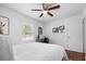 Bright bedroom featuring white walls, hardwood floors, a ceiling fan, and a workspace at 2751 36Th N Ave, St Petersburg, FL 33713