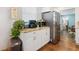 Kitchen featuring stainless steel refrigerator, granite countertops, and white cabinets at 2751 36Th N Ave, St Petersburg, FL 33713