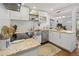 Kitchen with stainless steel appliances, white cabinets, and view to the living room at 2751 36Th N Ave, St Petersburg, FL 33713