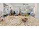 Kitchen island featuring beautiful granite countertops and adjacent to the living room at 2751 36Th N Ave, St Petersburg, FL 33713