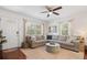 Bright living room with large windows, a sectional sofa, and hardwood floors at 2751 36Th N Ave, St Petersburg, FL 33713