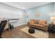 Comfortable living room with hardwood floors, a large window, and modern furnishings at 2751 36Th N Ave, St Petersburg, FL 33713