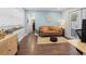 Inviting living room featuring hardwood floors, a comfortable sofa, and plenty of natural light at 2751 36Th N Ave, St Petersburg, FL 33713