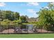 Backyard fire pit and deck overlooking the water at 3106 Whispering S Dr, Largo, FL 33771