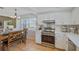 Bright, updated kitchen with stainless steel appliances and view to breakfast nook at 3106 Whispering S Dr, Largo, FL 33771