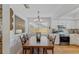 Updated kitchen with a wooden dining table and stainless steel appliances at 3106 Whispering S Dr, Largo, FL 33771