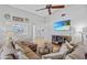 Comfortable living room features a large sectional sofa and a modern wall-mounted television at 3106 Whispering S Dr, Largo, FL 33771