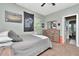 Bedroom with neutral walls, carpet and a wooden dresser, bed, and pennant hanging on the wall at 3408 W Bay Ave, Tampa, FL 33611