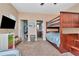 Bedroom featuring a closet, bathroom and bunk beds with striped bedding and ceiling fan at 3408 W Bay Ave, Tampa, FL 33611