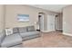 Bonus room with neutral carpet features a couch, two doors, and wall decorations at 3408 W Bay Ave, Tampa, FL 33611