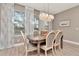 Bright dining room with hardwood floors, stylish lighting, and a cozy atmosphere at 3408 W Bay Ave, Tampa, FL 33611