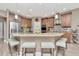 Kitchen island with stone countertops, stainless steel appliances, and hardwood floors at 3408 W Bay Ave, Tampa, FL 33611