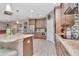 Kitchen with stainless steel appliances, stone countertops, and barstool seating at 3408 W Bay Ave, Tampa, FL 33611