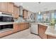 Modern kitchen with stainless steel appliances, granite countertops, and stylish cabinetry at 3408 W Bay Ave, Tampa, FL 33611
