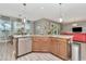 Kitchen with stone countertops and stainless steel appliances with an attached dining area at 3408 W Bay Ave, Tampa, FL 33611