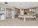 Spacious kitchen with stainless steel appliances, stone countertops, and hardwood floors at 3408 W Bay Ave, Tampa, FL 33611