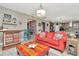 Bright living room featuring hardwood floors, ample seating, and seamless flow into the kitchen, perfect for entertaining at 3408 W Bay Ave, Tampa, FL 33611
