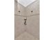 Contemporary tiled shower with dual showerheads and built-in shelving for toiletries at 3408 W Bay Ave, Tampa, FL 33611