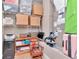 Utility room with shelves, storage, and a desk features a chair and well-lit area at 3408 W Bay Ave, Tampa, FL 33611