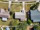 Aerial view showcasing the home's layout, yard, and proximity to the street at 428 Flamingo Dr, Apollo Beach, FL 33572