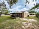 The home's backyard also features an enclosed porch and lush lawn at 428 Flamingo Dr, Apollo Beach, FL 33572