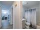 Bathroom featuring vanity, toilet, and shower with modern patterned shower curtain at 428 Flamingo Dr, Apollo Beach, FL 33572