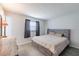 Bedroom with a queen size bed, dresser and neutral decor at 428 Flamingo Dr, Apollo Beach, FL 33572