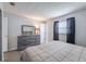 Bright bedroom features neutral paint, wood floors, and a large dresser with mirror at 428 Flamingo Dr, Apollo Beach, FL 33572
