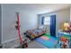 Bedroom with a single bed, play mats and a window offering natural light at 428 Flamingo Dr, Apollo Beach, FL 33572